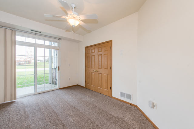 6739 Meadowlands Circle, Unit 6A Pleasant Prairie, WI 53158 - Photo 14 of 19 a view of an empty room with a window
