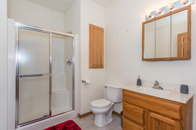 6739 Meadowlands Circle, Unit 6A Pleasant Prairie, WI 53158 - Photo 17 of 19 a bathroom with a sink a toilet and shower