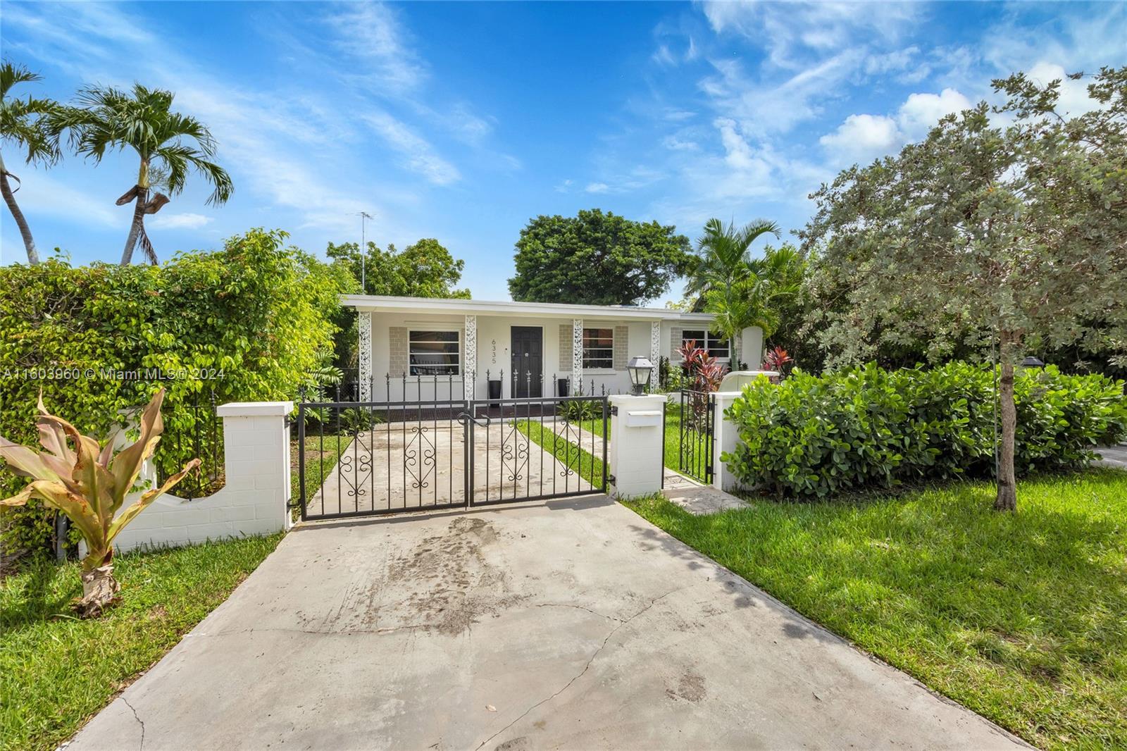 6335 Southwest 33rd Street Miami, FL 33155 - Photo 1 of 37 Gated drives with pedestrian gate.