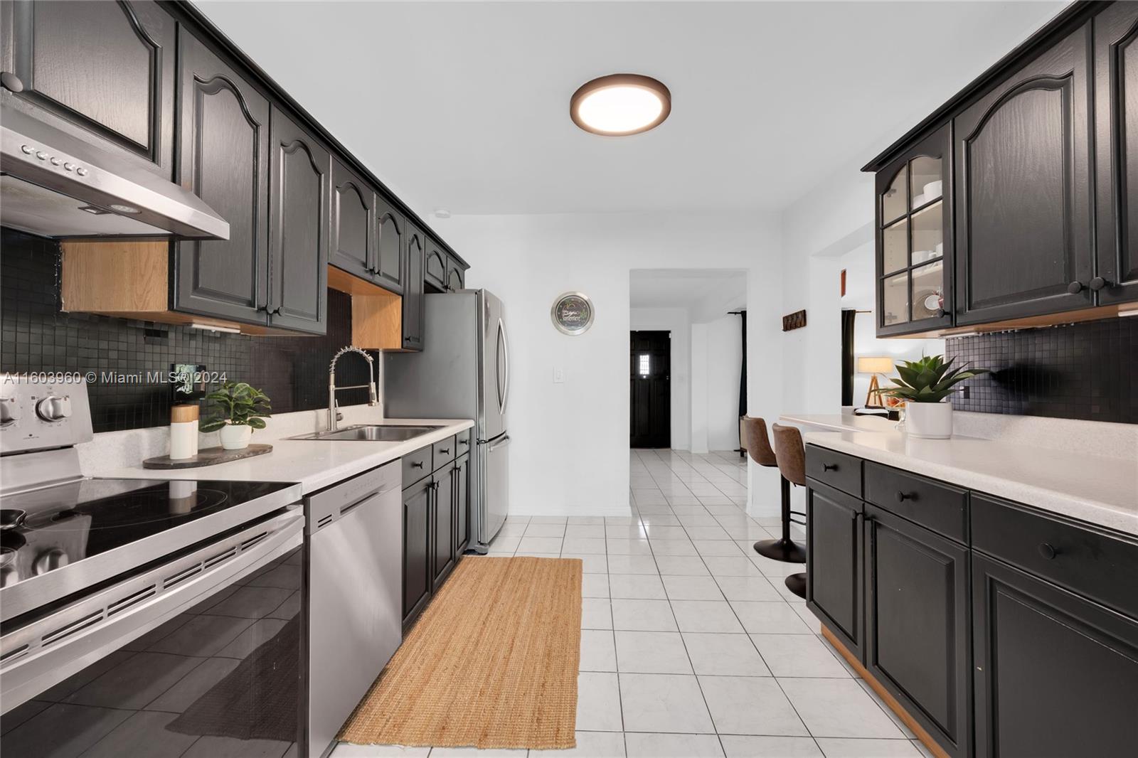 6335 Southwest 33rd Street Miami, FL 33155 - Photo 21 of 37 Kitchen with pass through Breakfast Bar to Living Room.