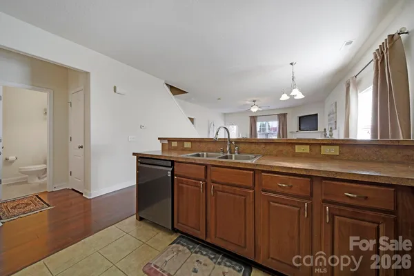 a spacious bathroom with a granite countertop sink and a mirror