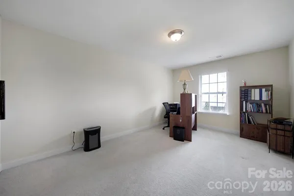 a room with furniture and a lamp