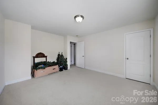 a view of a livingroom with furniture and a natural light