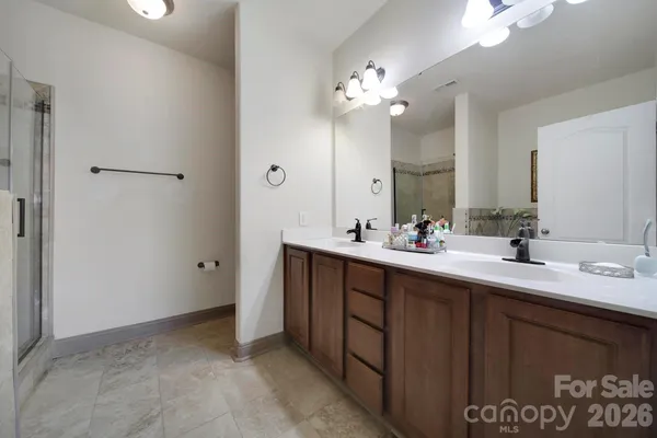 a bathroom with a double vanity sink and a mirror