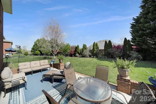 a patio with patio a yard and outdoor seating