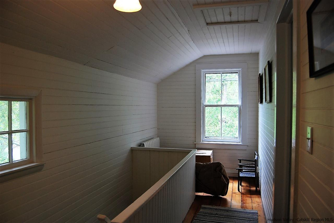 3424 Cooper Street Stone Ridge, NY 12484 - Photo 12 of 24 a view of a hallway with furniture and a window