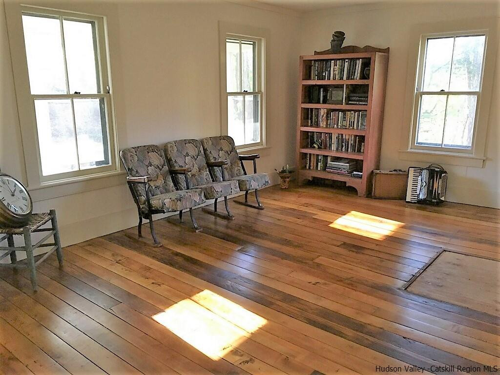 3424 Cooper Street Stone Ridge, NY 12484 - Photo 2 of 24 a living room with furniture window and wooden floor