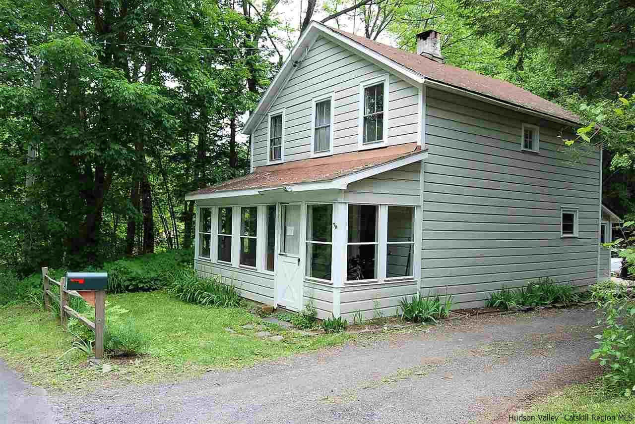 3424 Cooper Street Stone Ridge, NY 12484 - Photo 21 of 24 a house with trees in the background
