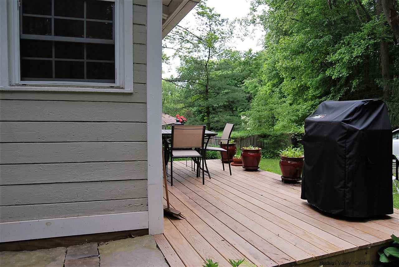 3424 Cooper Street Stone Ridge, NY 12484 - Photo 23 of 24 a view of a deck with chairs and a yard