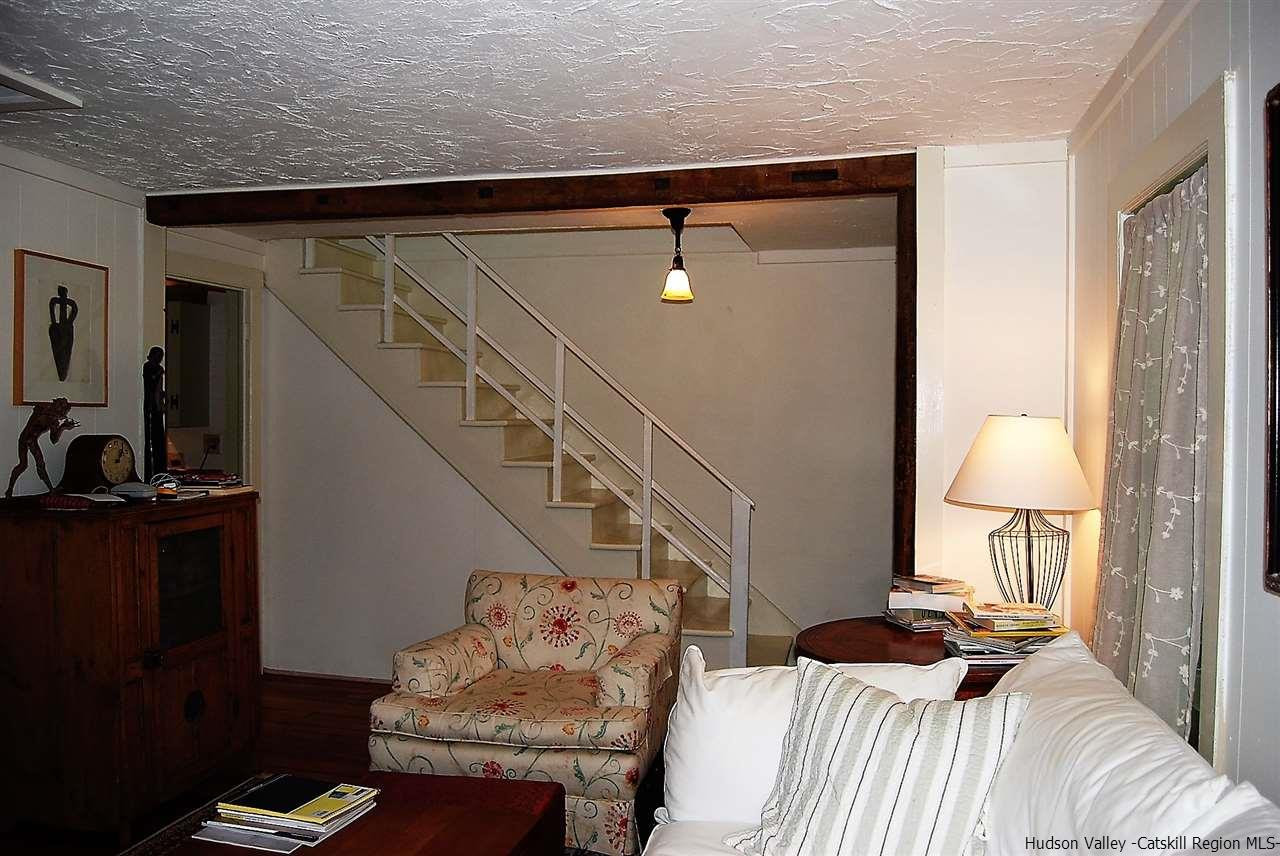 3424 Cooper Street Stone Ridge, NY 12484 - Photo 3 of 24 a bedroom with a bed and a lamp on the dresser