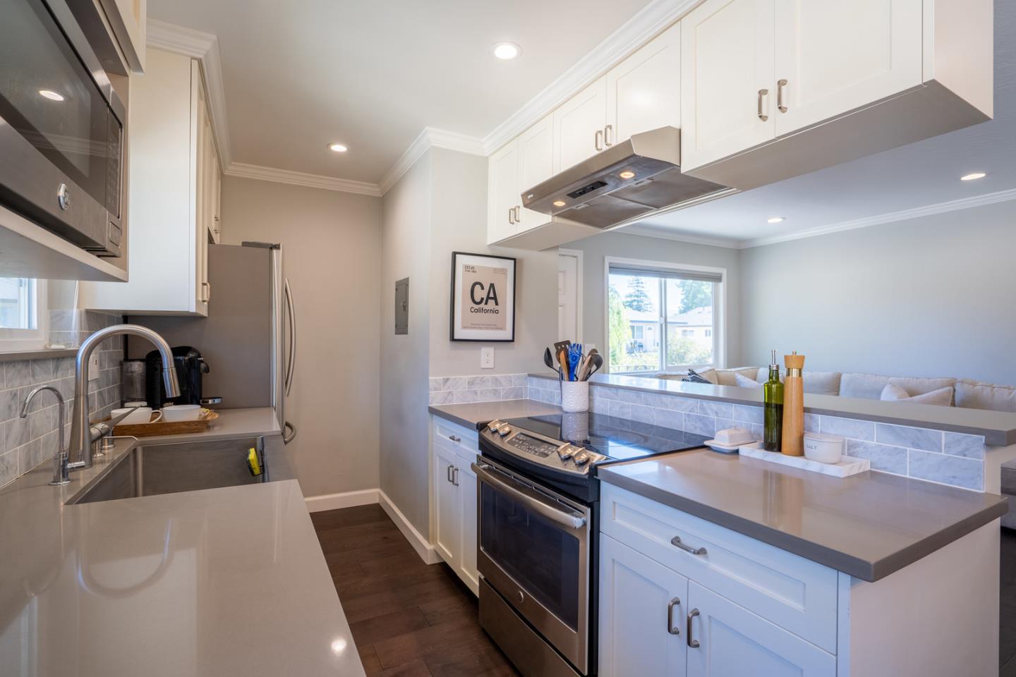 230 Watson Drive, Unit 4 Campbell, CA 95008 - Photo 2 of 17 a kitchen with stainless steel appliances granite countertop a sink and stove