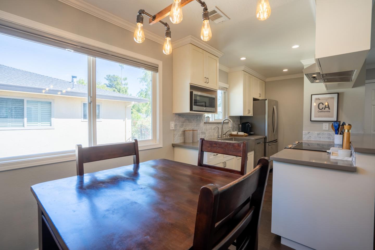 230 Watson Drive, Unit 4 Campbell, CA 95008 - Photo 5 of 17 a living room with furniture a large window and a flat screen tv