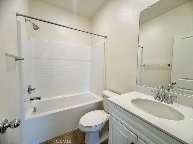 a bathroom with a sink toilet and a bathtub