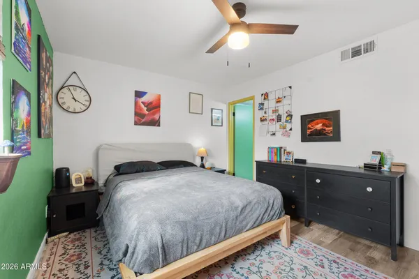 a bed room with a bed and a window