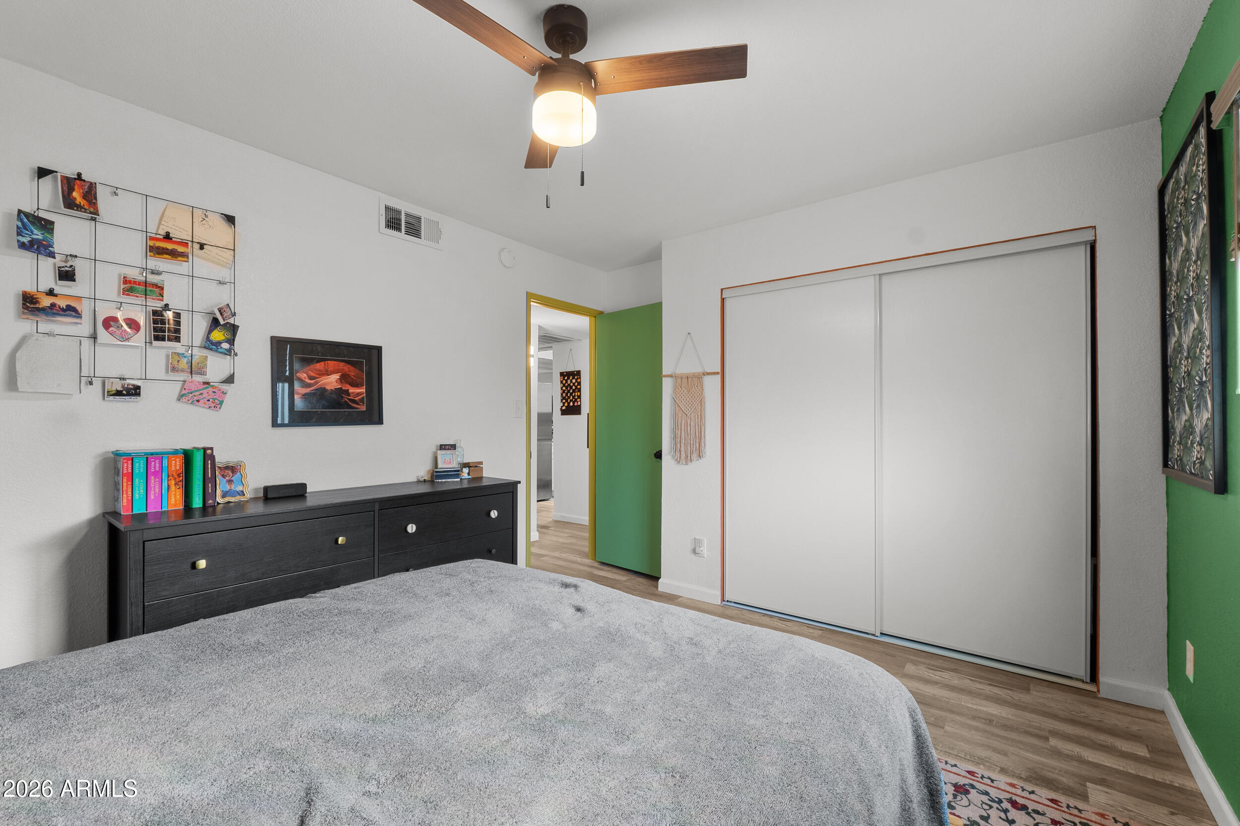 202 East Ruth Avenue, Unit 2 Phoenix, AZ 85020 - Photo 12 of 25 a bedroom with a bed and a dresser