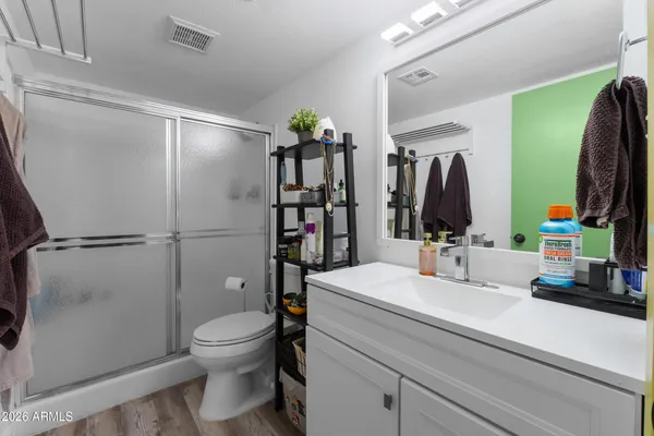 a bedroom with a bed and a dresser