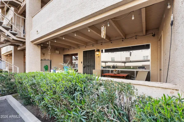 a view of a house with a small yard