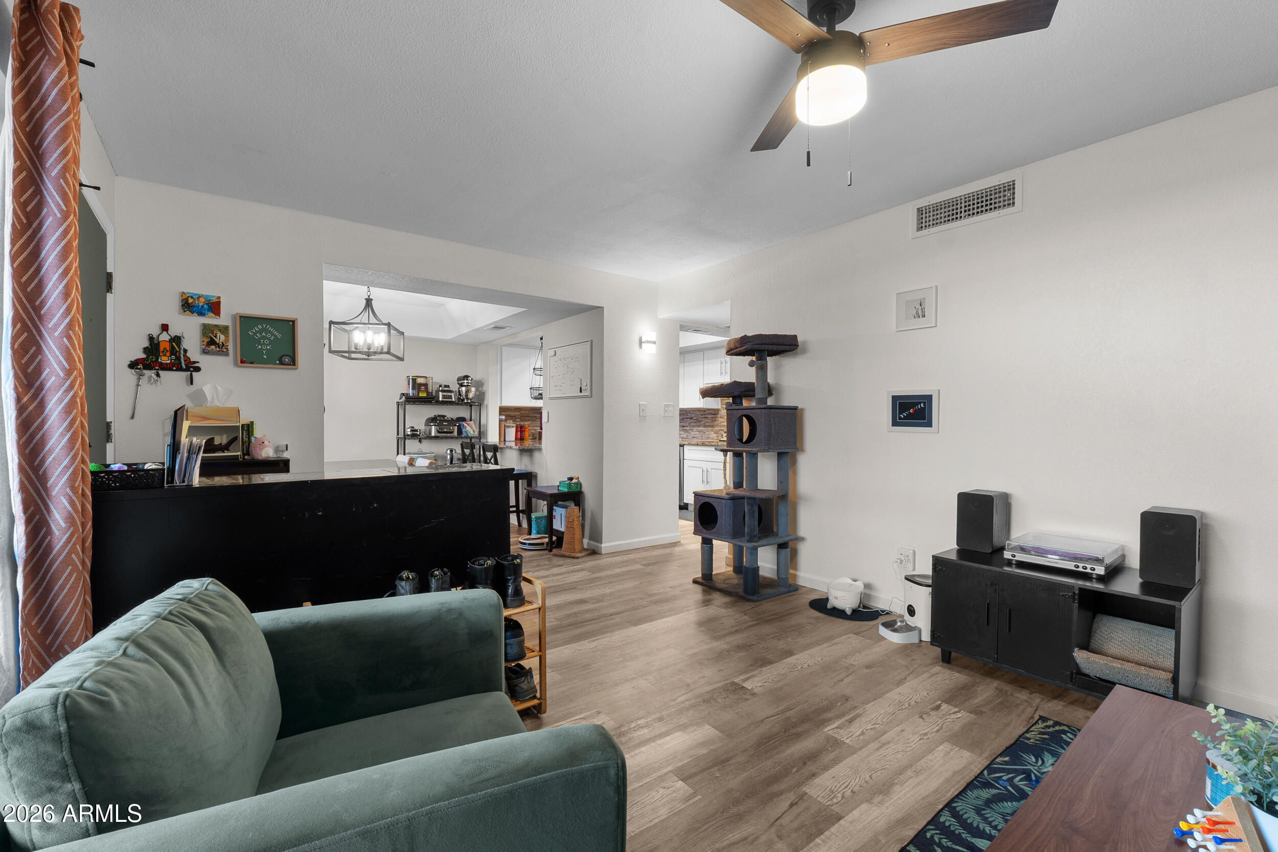 202 East Ruth Avenue, Unit 2 Phoenix, AZ 85020 - Photo 2 of 25 a living room with furniture and a wooden floor