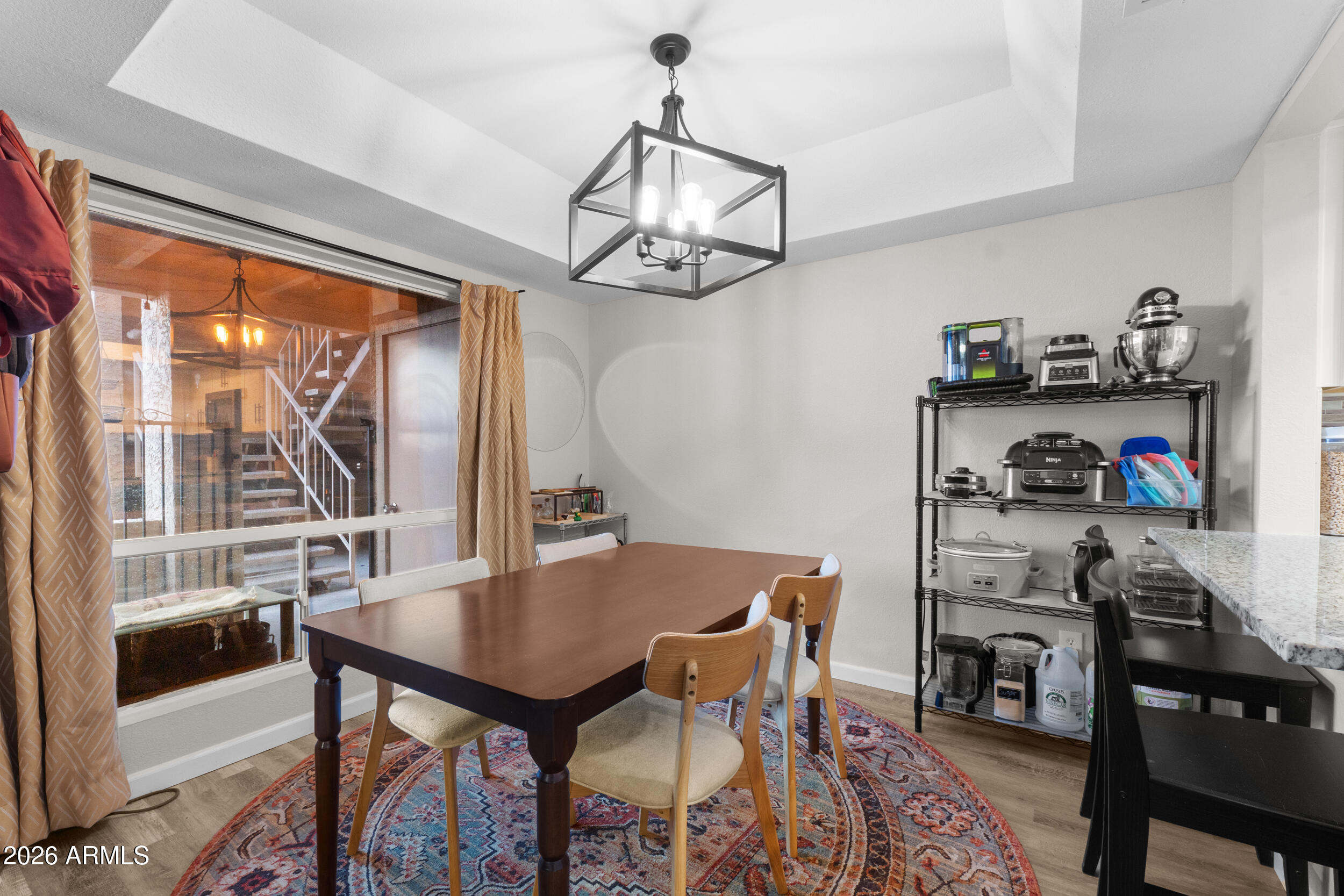 202 East Ruth Avenue, Unit 2 Phoenix, AZ 85020 - Photo 4 of 25 a view of a dining room with furniture window and outside view