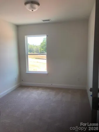 a view of hallway with closet