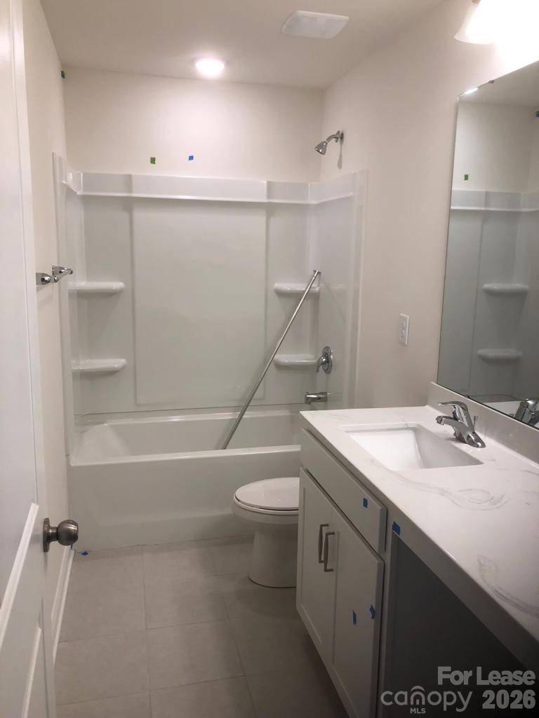 190 Waterlynn Ridge Road, Unit C Mooresville, NC 28117 - Photo 6 of 13 a bathroom with a sink a toilet and shower