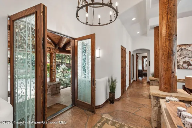 a living room with fireplace furniture and a fireplace