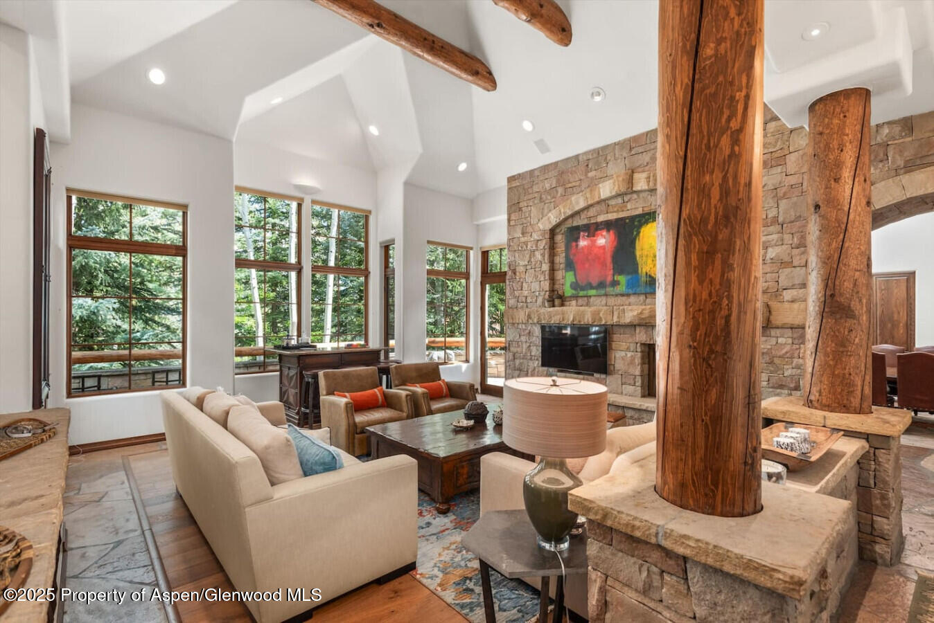 27 Timber Ridge Lane Snowmass Village, CO 81615 - Photo 15 of 40 a living room with furniture large windows and wooden floor