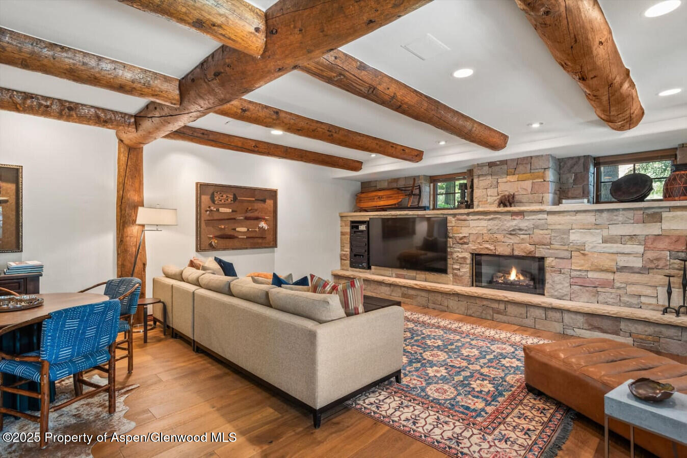 27 Timber Ridge Lane Snowmass Village, CO 81615 - Photo 24 of 40 a living room with furniture and a fireplace