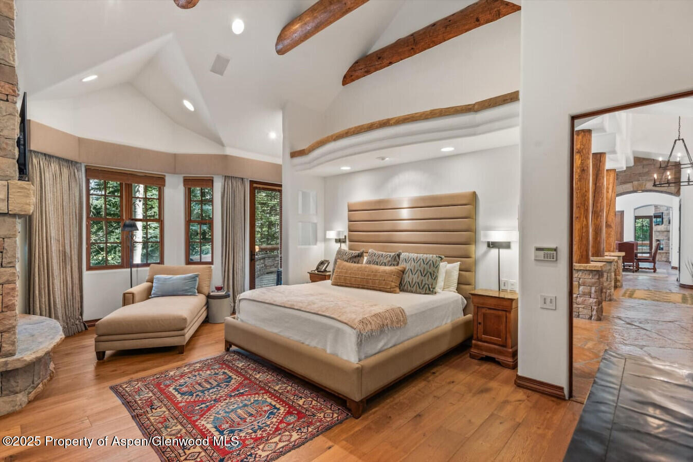 27 Timber Ridge Lane Snowmass Village, CO 81615 - Photo 26 of 40 a bedroom with a large bed and a couch