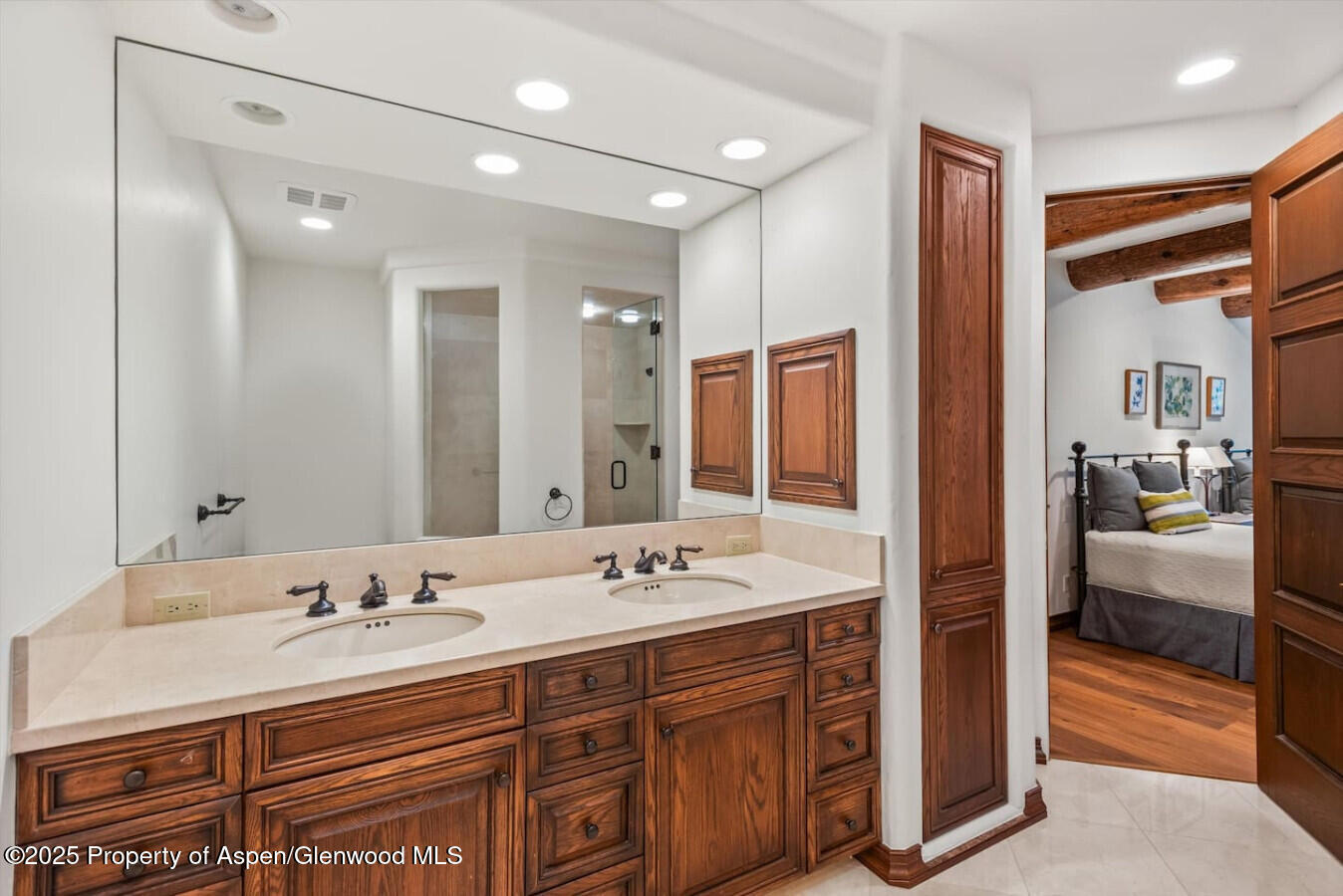 27 Timber Ridge Lane Snowmass Village, CO 81615 - Photo 33 of 40 a spacious bathroom with a shower double sink and a mirror