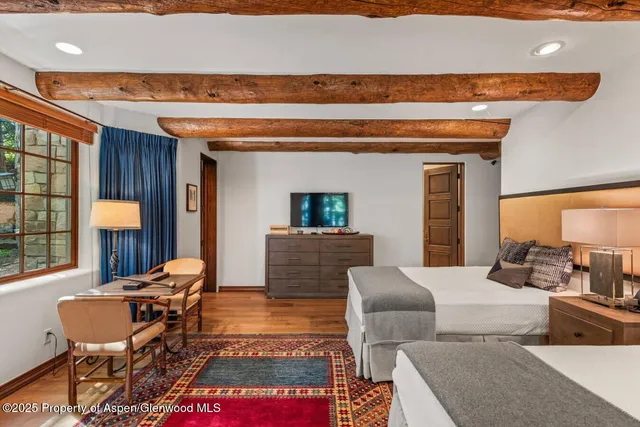 a bathroom with a double vanity sink toilet and a mirror