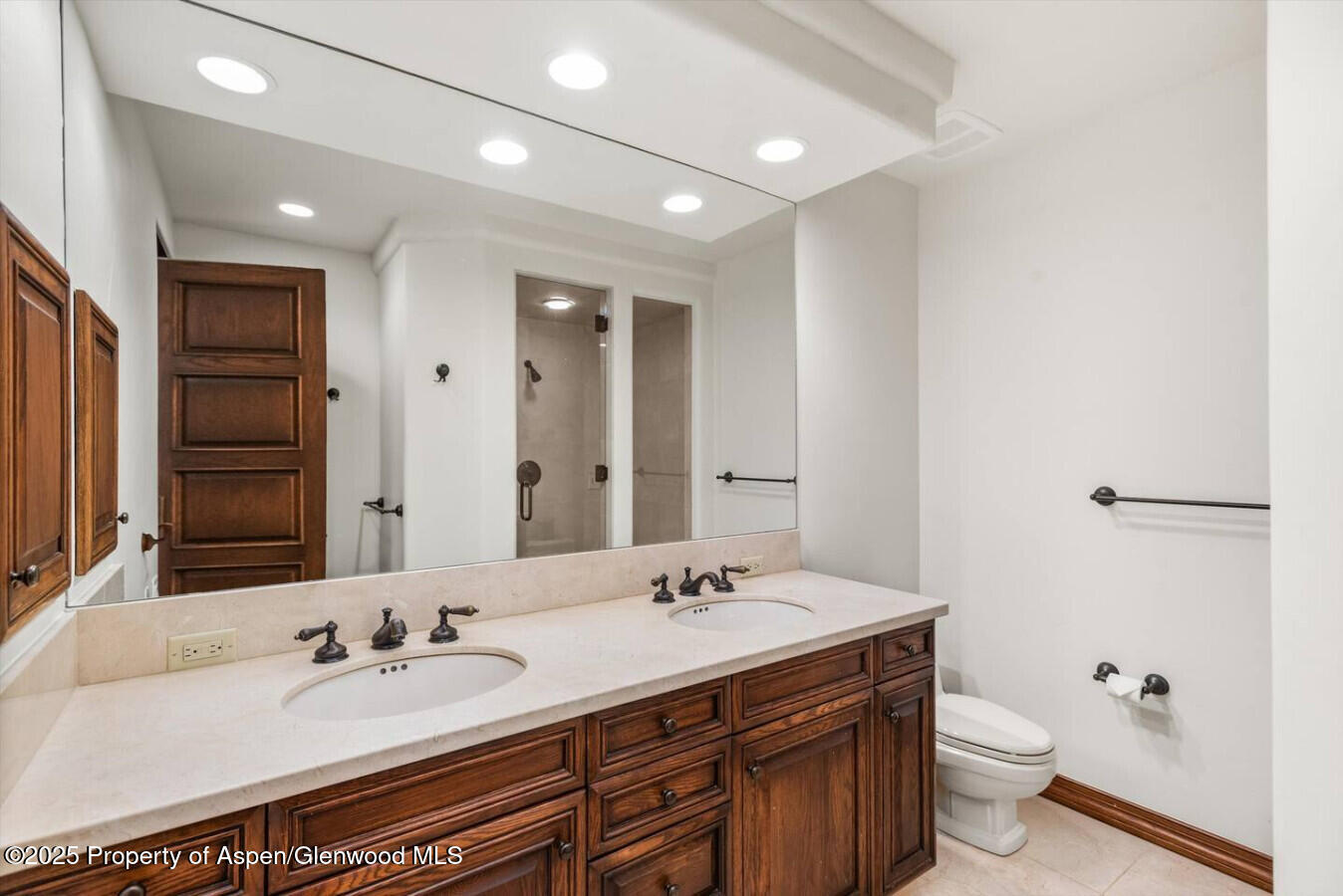 27 Timber Ridge Lane Snowmass Village, CO 81615 - Photo 35 of 40 a bathroom with a double vanity sink toilet and a mirror