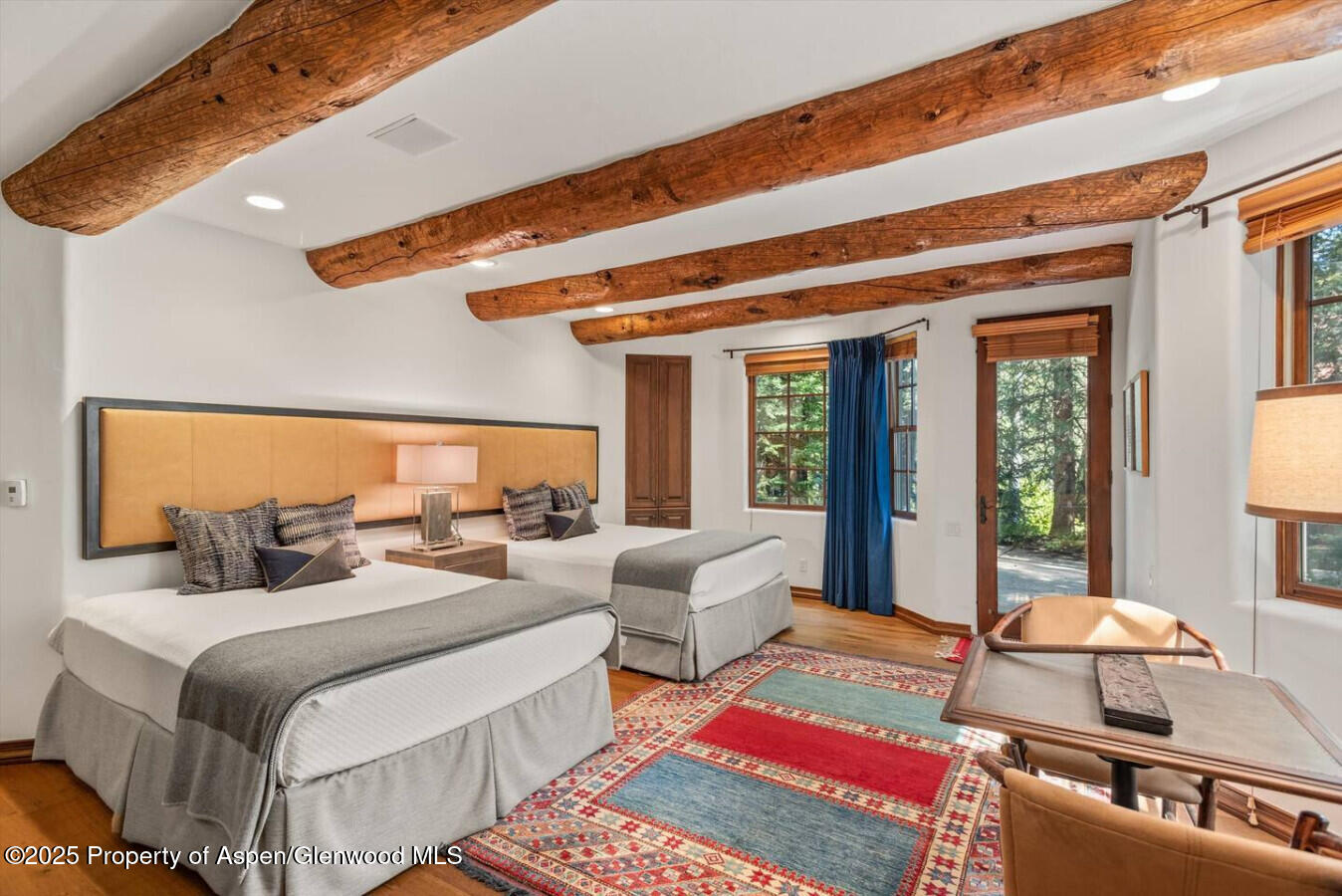 27 Timber Ridge Lane Snowmass Village, CO 81615 - Photo 36 of 40 a bedroom with two beds and a large window