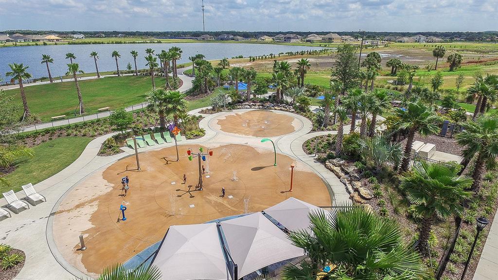 5131 Spring Maiden Circle Apollo Beach, FL 33572 - Photo 24 of 25 an aerial view of residential houses with outdoor space and swimming pool