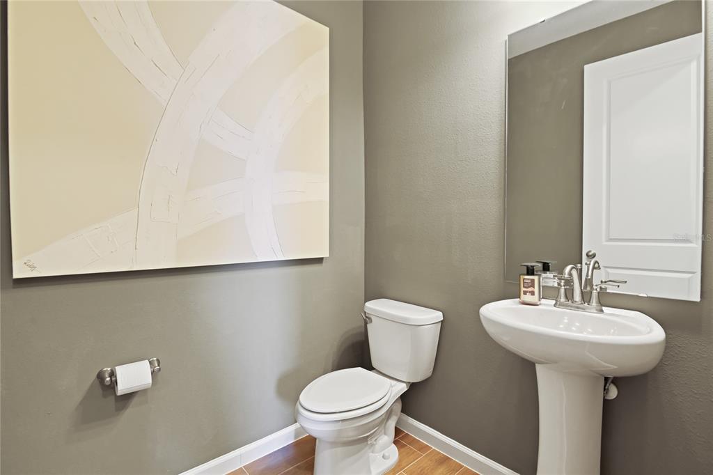 5131 Spring Maiden Circle Apollo Beach, FL 33572 - Photo 3 of 25 a bathroom with a sink toilet and a mirror