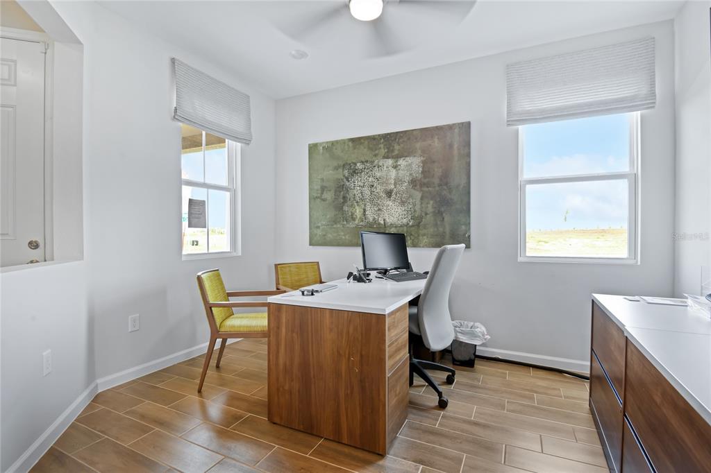 5131 Spring Maiden Circle Apollo Beach, FL 33572 - Photo 4 of 25 a view of a workspace with furniture and a window