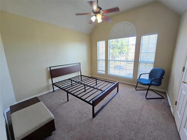 a living room with furniture a window and a chandelier