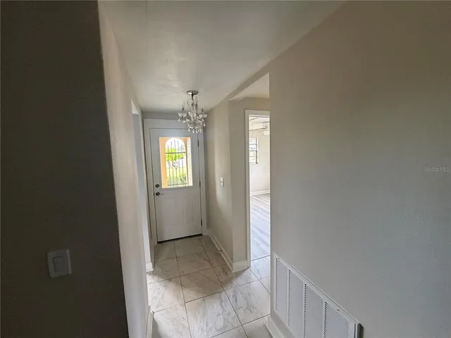 a view of an empty room and window