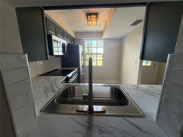 a living room with a couch and a table