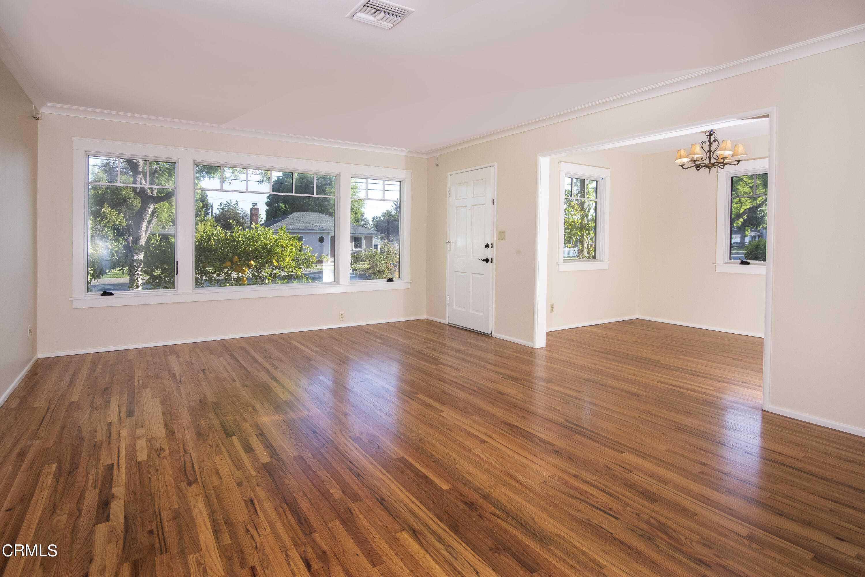 2901 Paloma Street Pasadena, CA 91107 - Photo 14 of 41 a view of an empty room with wooden floor and a window
