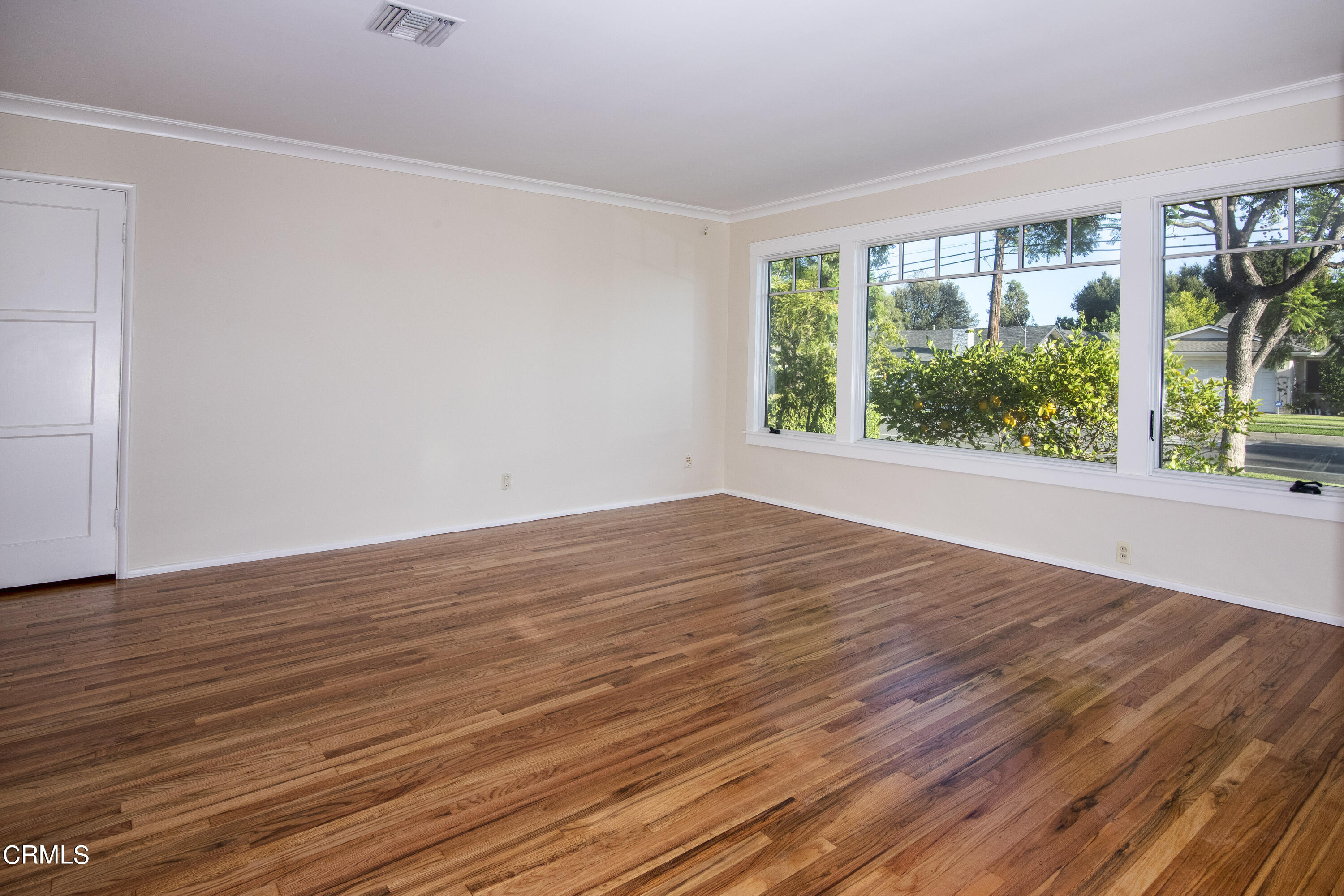 2901 Paloma Street Pasadena, CA 91107 - Photo 15 of 41 a view of an empty room with wooden floor and a window