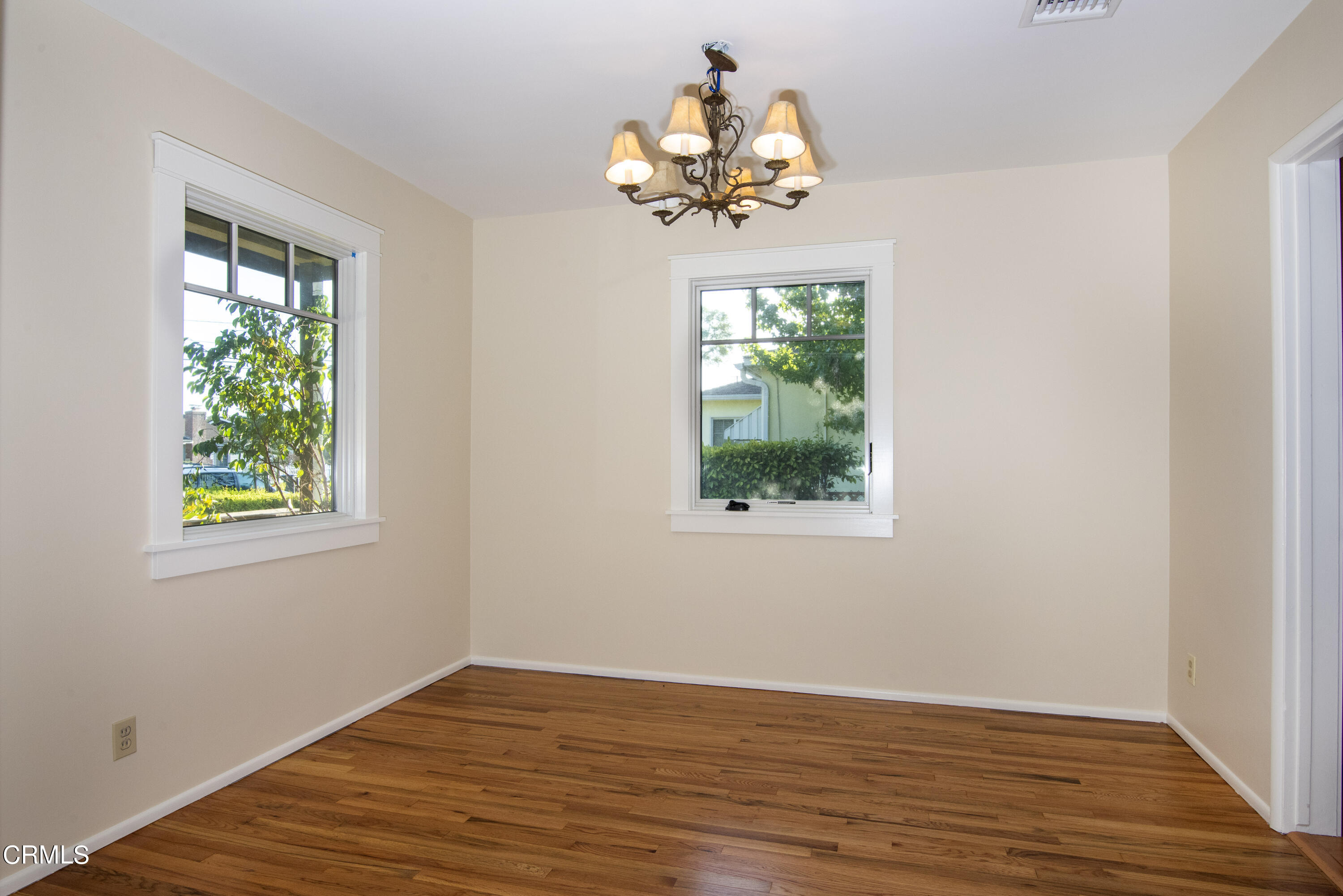 2901 Paloma Street Pasadena, CA 91107 - Photo 19 of 41 a view of a room with wooden floor chandelier and a window