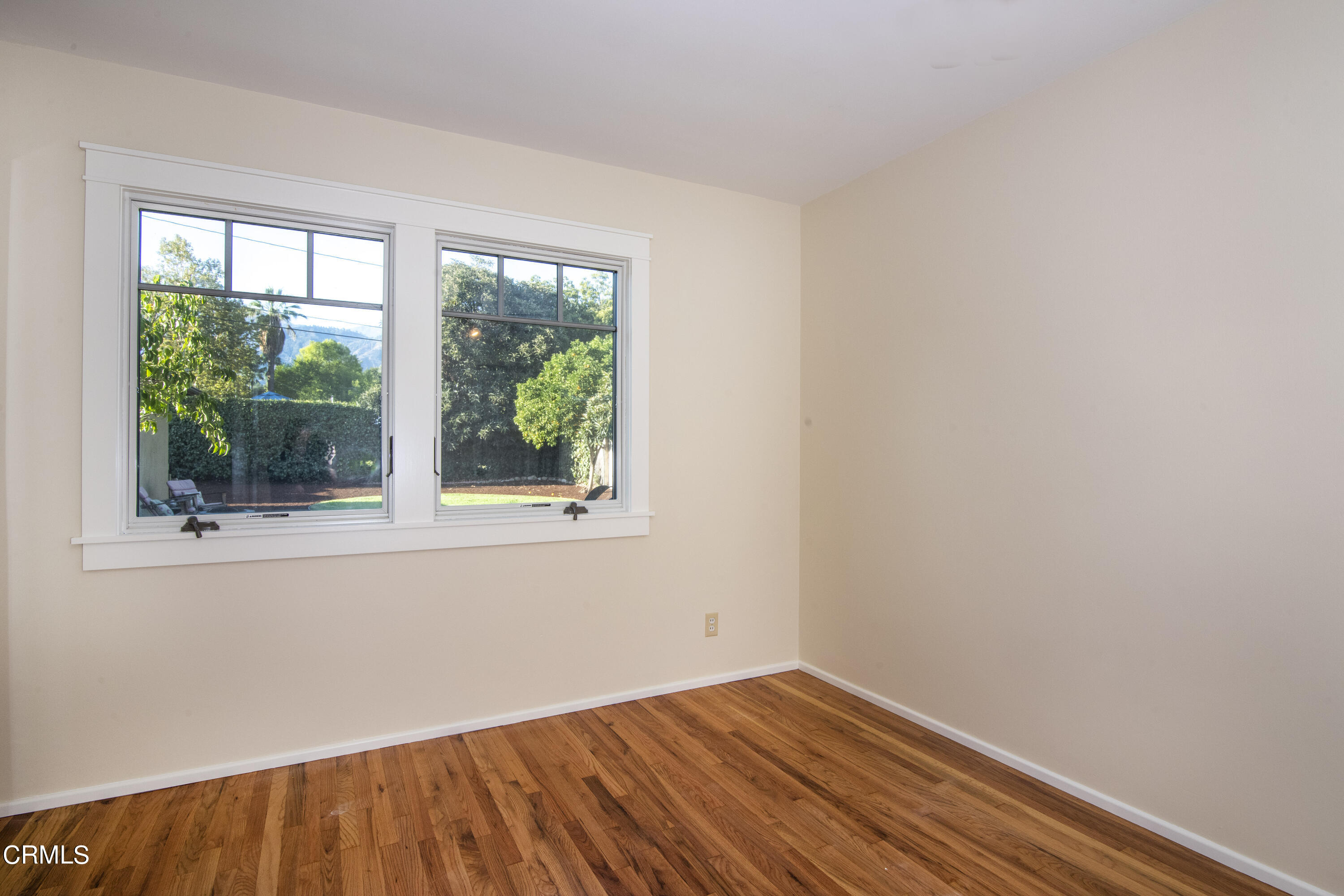 2901 Paloma Street Pasadena, CA 91107 - Photo 21 of 41 an empty room with wooden floor and windows