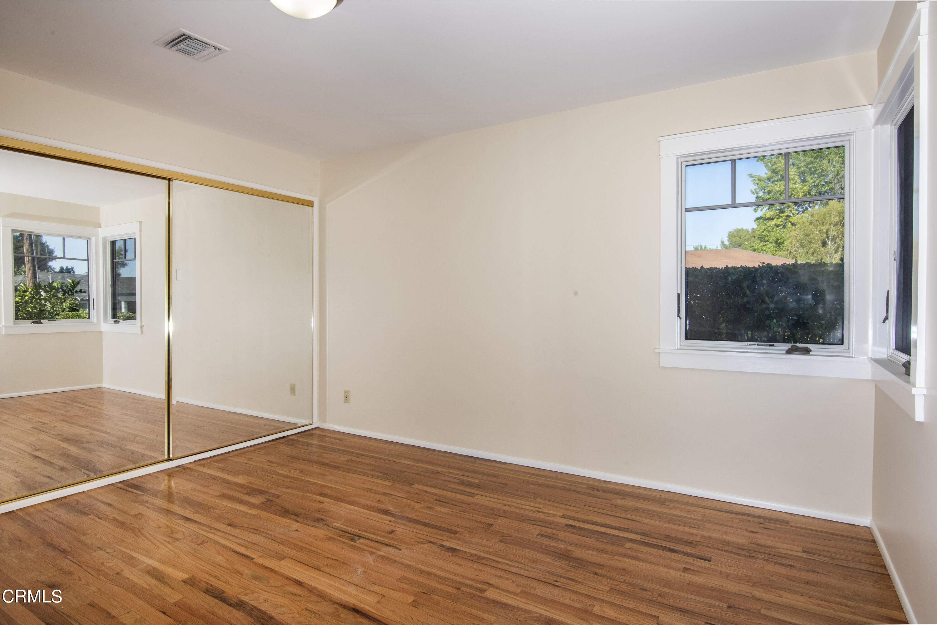 2901 Paloma Street Pasadena, CA 91107 - Photo 35 of 41 an empty room with wooden floor and windows