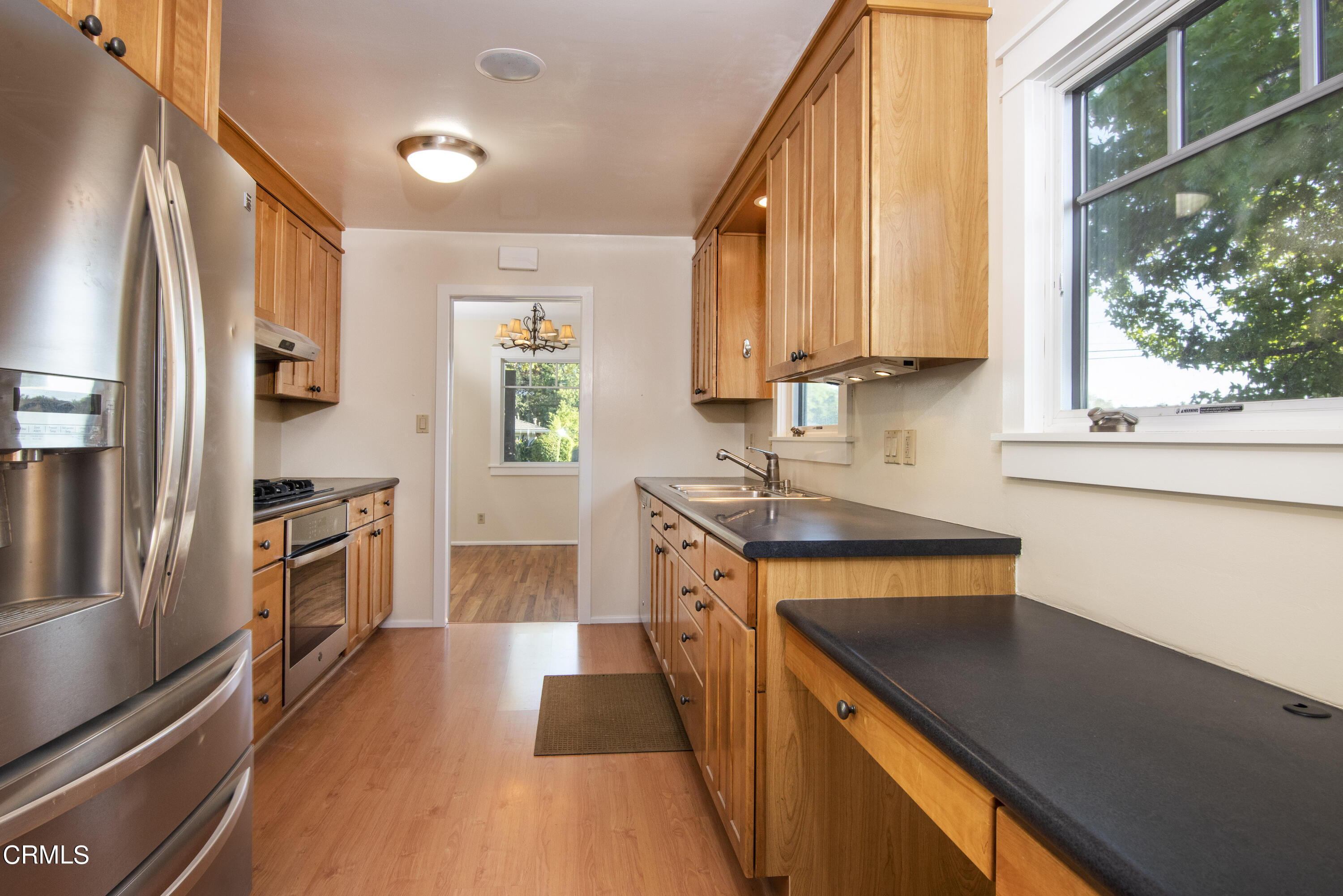 2901 Paloma Street Pasadena, CA 91107 - Photo 38 of 41 a kitchen with a sink a counter top space stainless steel appliances a large window and cabinets