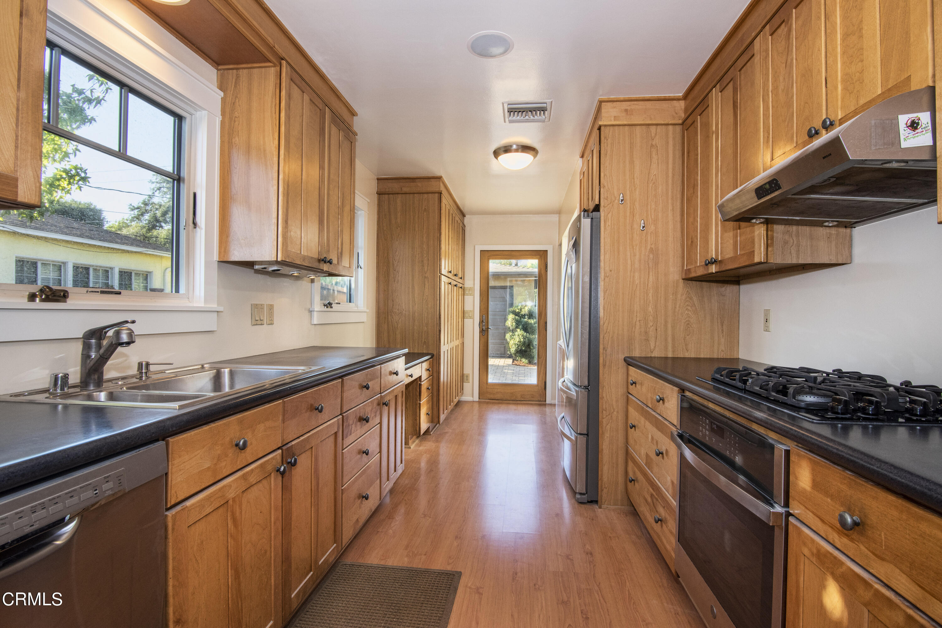 2901 Paloma Street Pasadena, CA 91107 - Photo 39 of 41 a kitchen with stainless steel appliances a stove a sink and a refrigerator