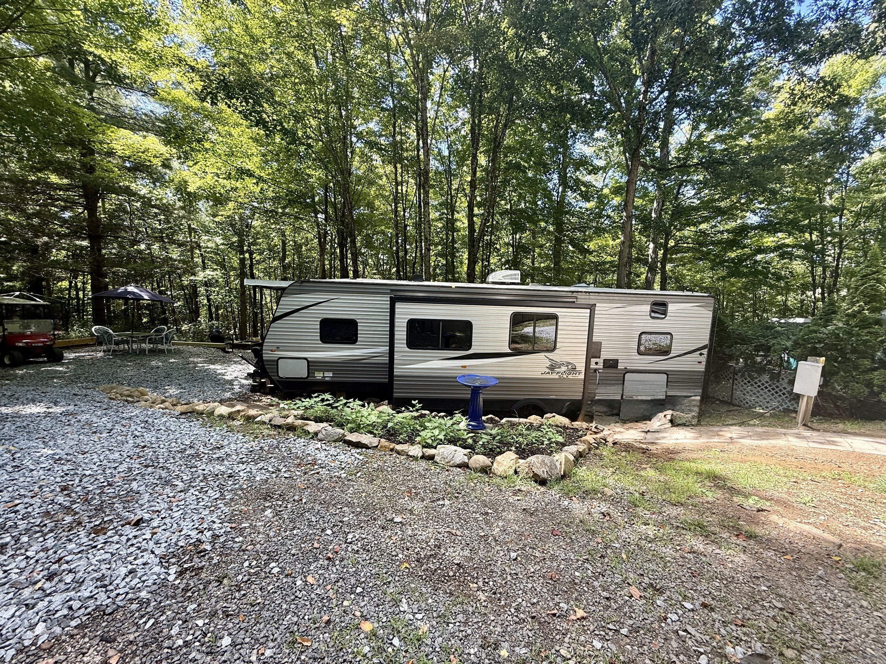 8 S Road, Unit R80 Stafford, CT 06076 - Photo 1 of 36 a front view of a house with a yard