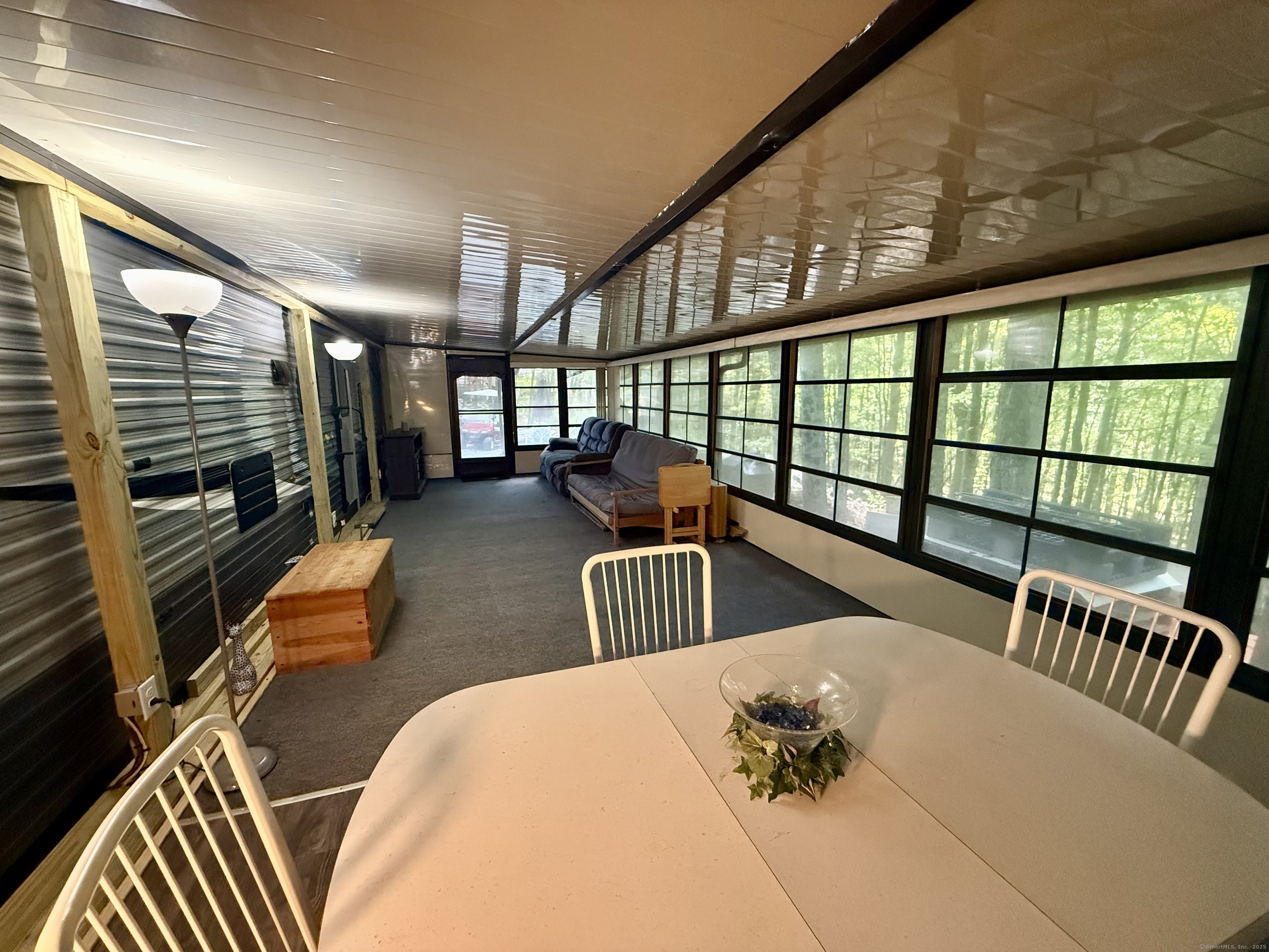 8 S Road, Unit R80 Stafford, CT 06076 - Photo 11 of 36 a bedroom with furniture and a large window