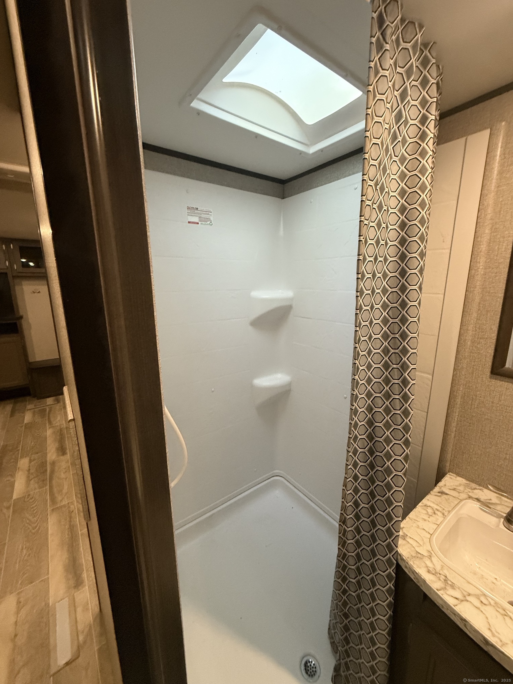 8 S Road, Unit R80 Stafford, CT 06076 - Photo 19 of 36 a bathroom with a sink and a shower