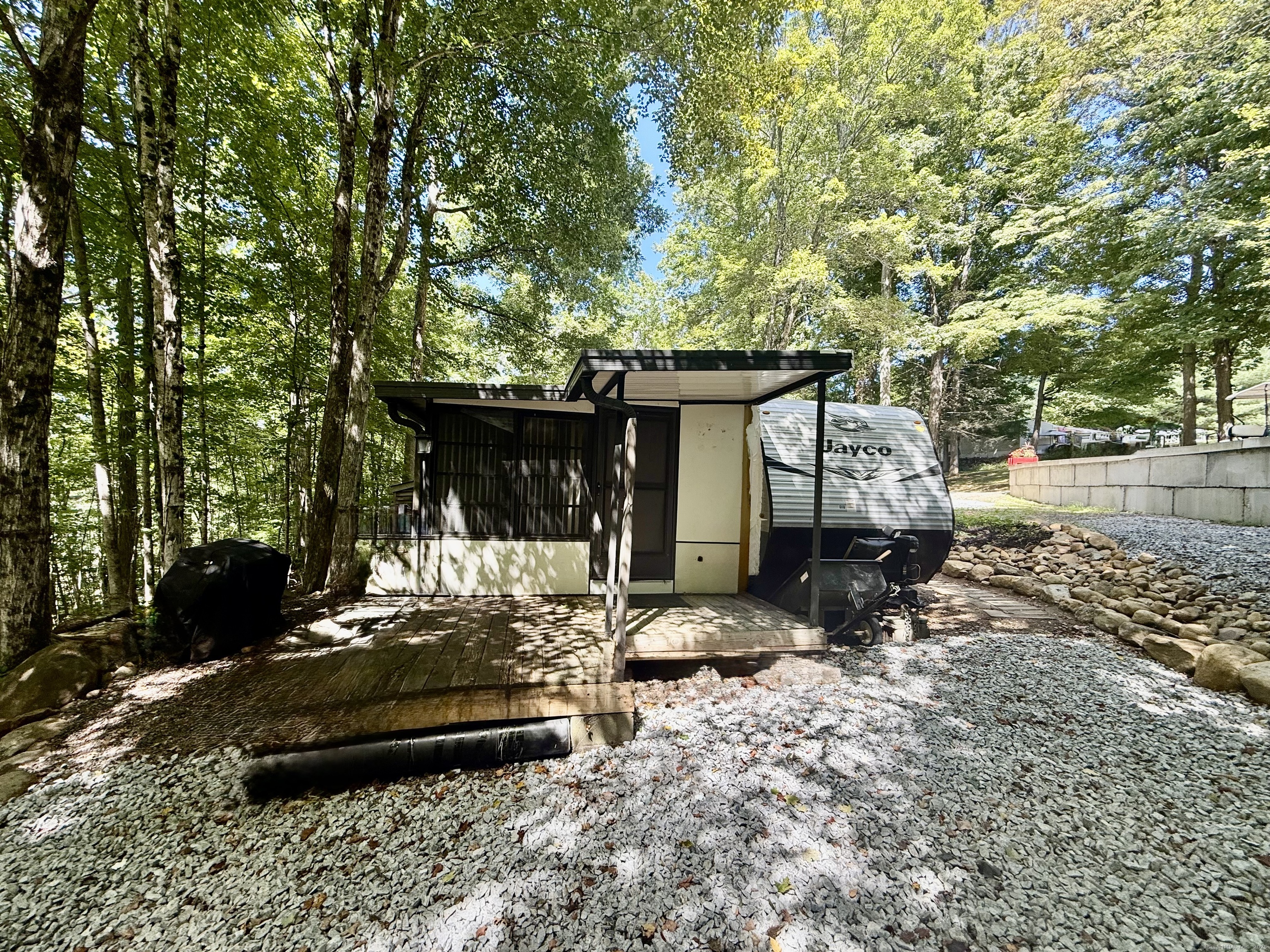 8 S Road, Unit R80 Stafford, CT 06076 - Photo 2 of 36 a view of a house with a yard